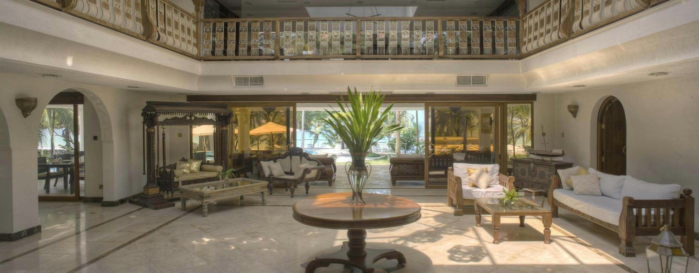 Light-filled entrance hall and lounge at Almanara