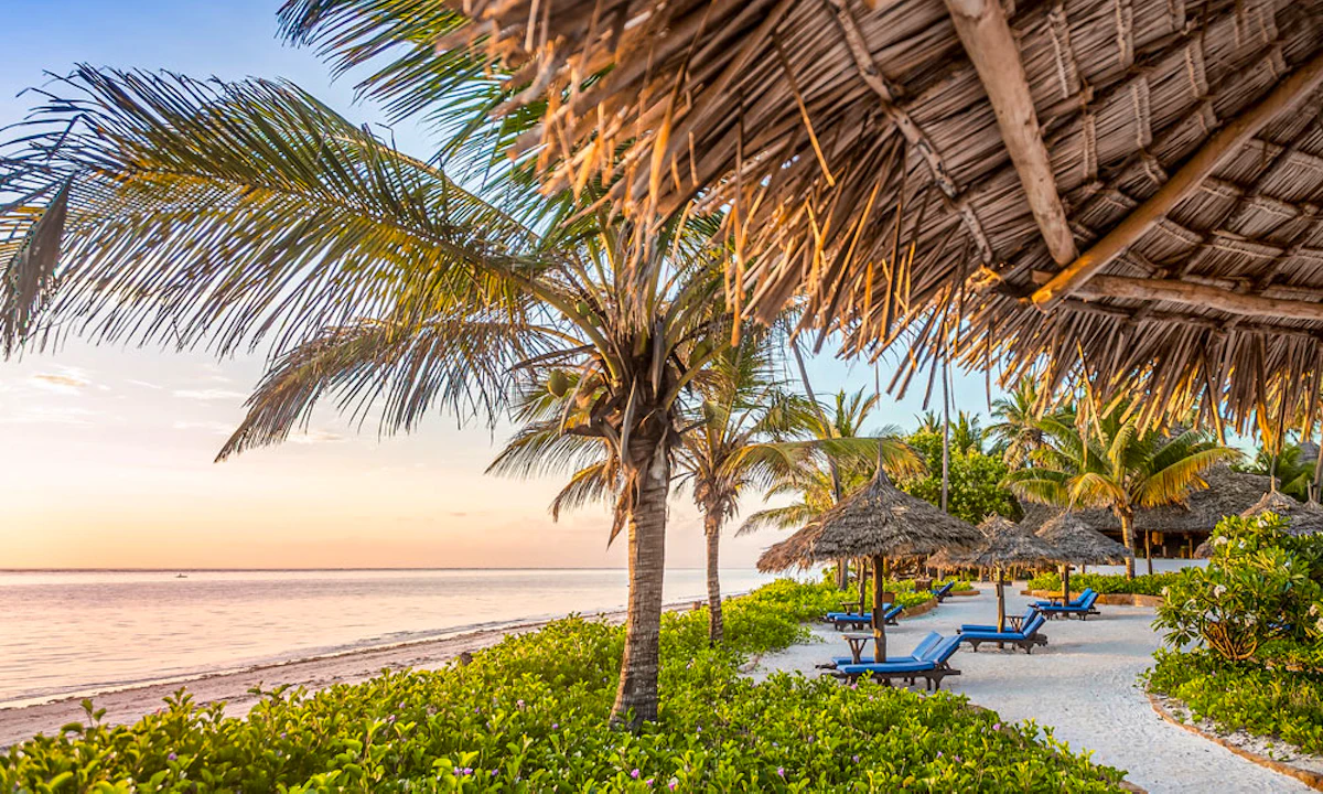 A tropical beach on Zanzibar with white sand and palm trees