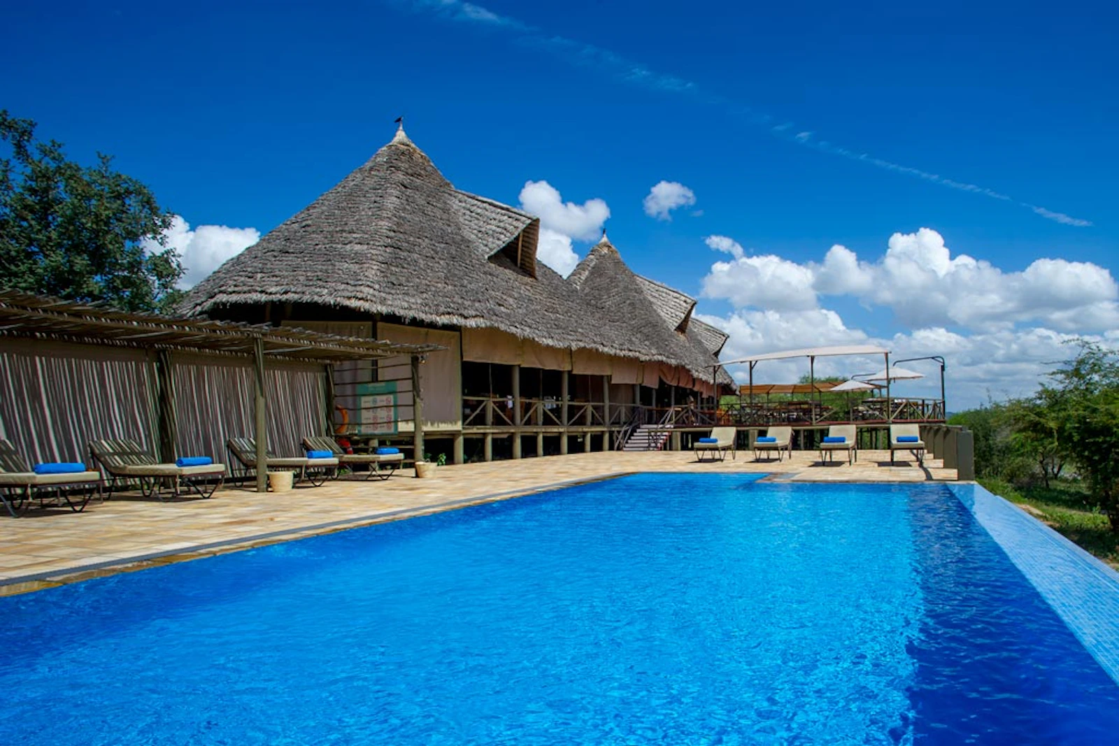 Swimming pool and main lodge at Burunge Tented Lodge
