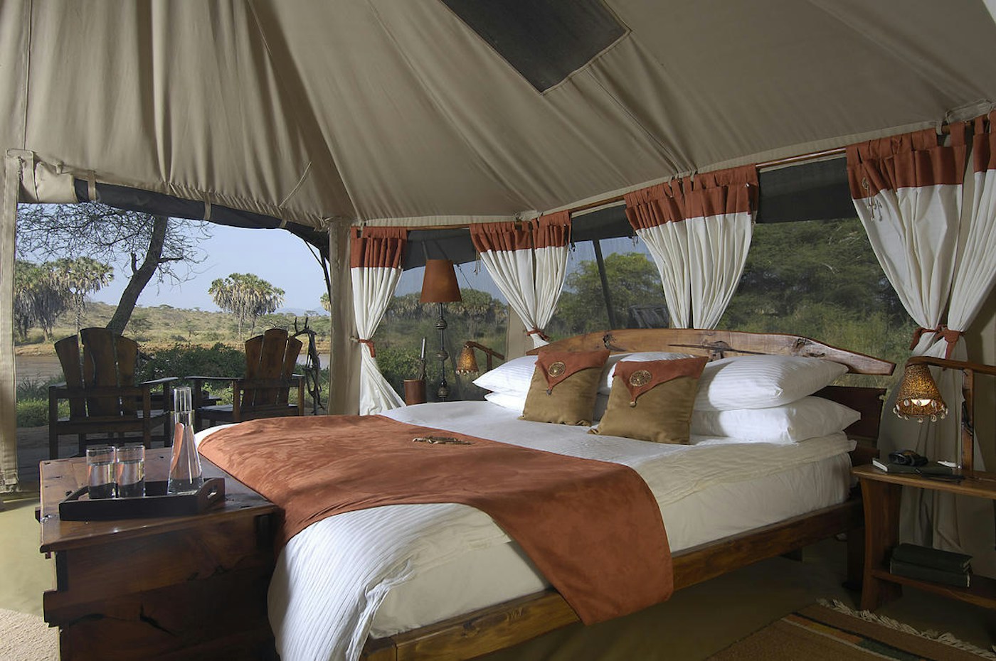 Double bed inside a guest tent at Elephant Bedroom Camp
