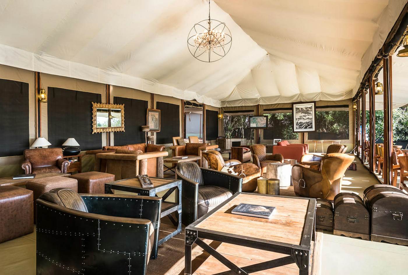 Camp lounge with armchairs and sofas at Entim Mara Camp