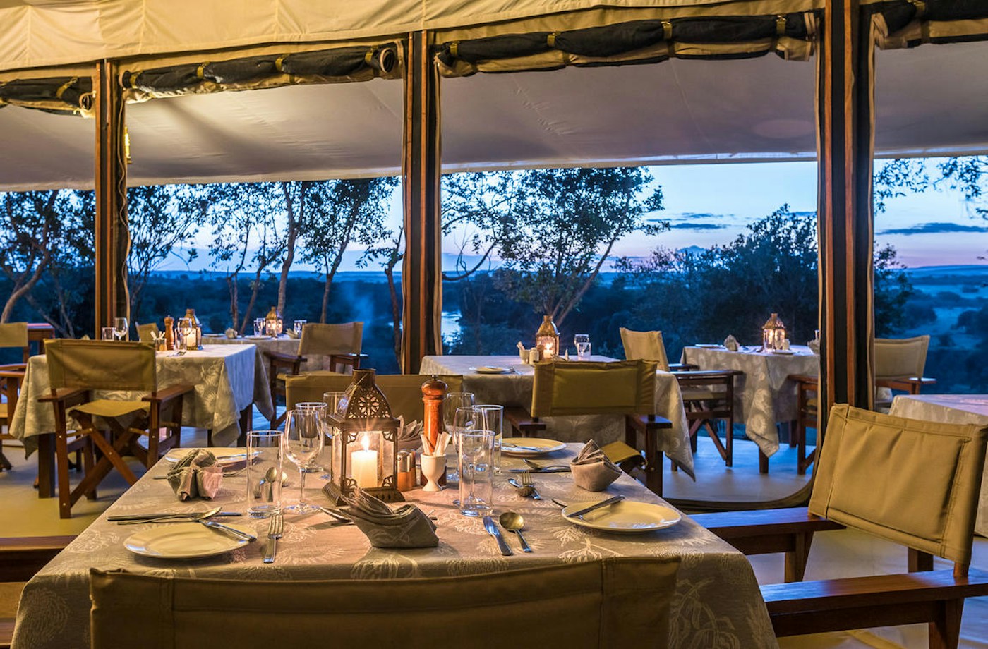 Main dining area set for dinner at Entim Mara Camp