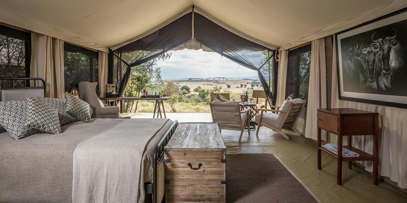 Guest tent bedroom looking onto the Mara plains at Entim Mara Camp