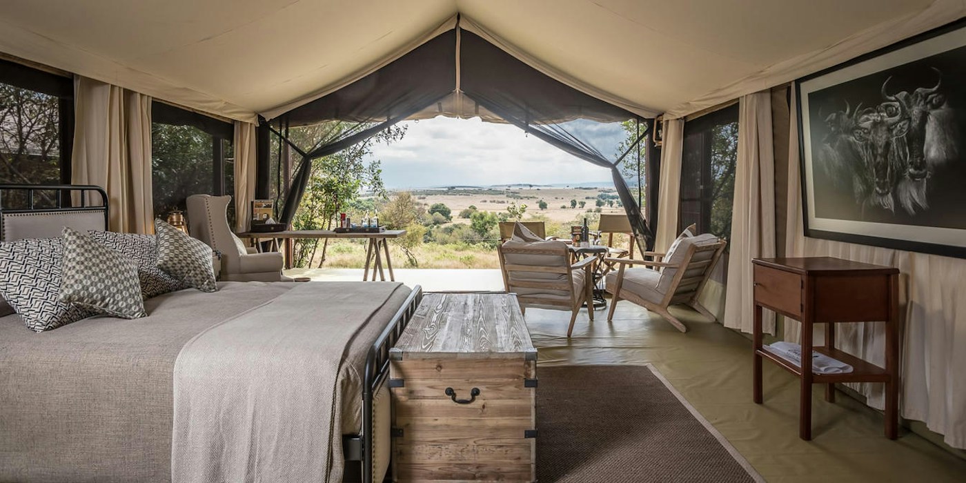Guest tent bedroom looking onto the Mara plains at Entim Mara Camp