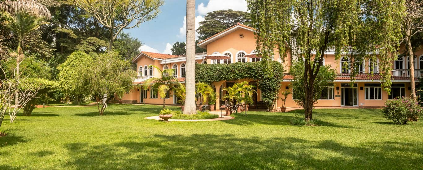 House and lawns in the landscaped gardens at House of Waine