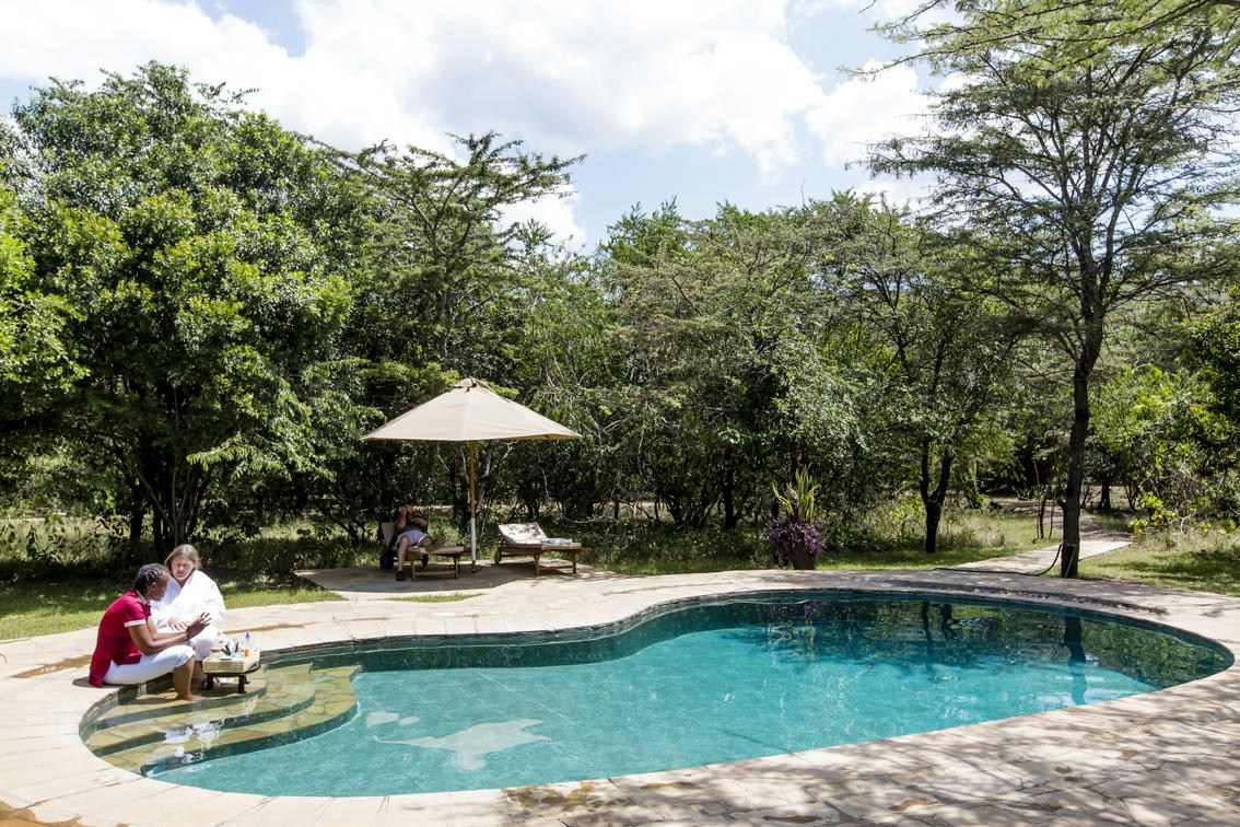Swimming pool beneath the camp trees at Karen Blixen Camp