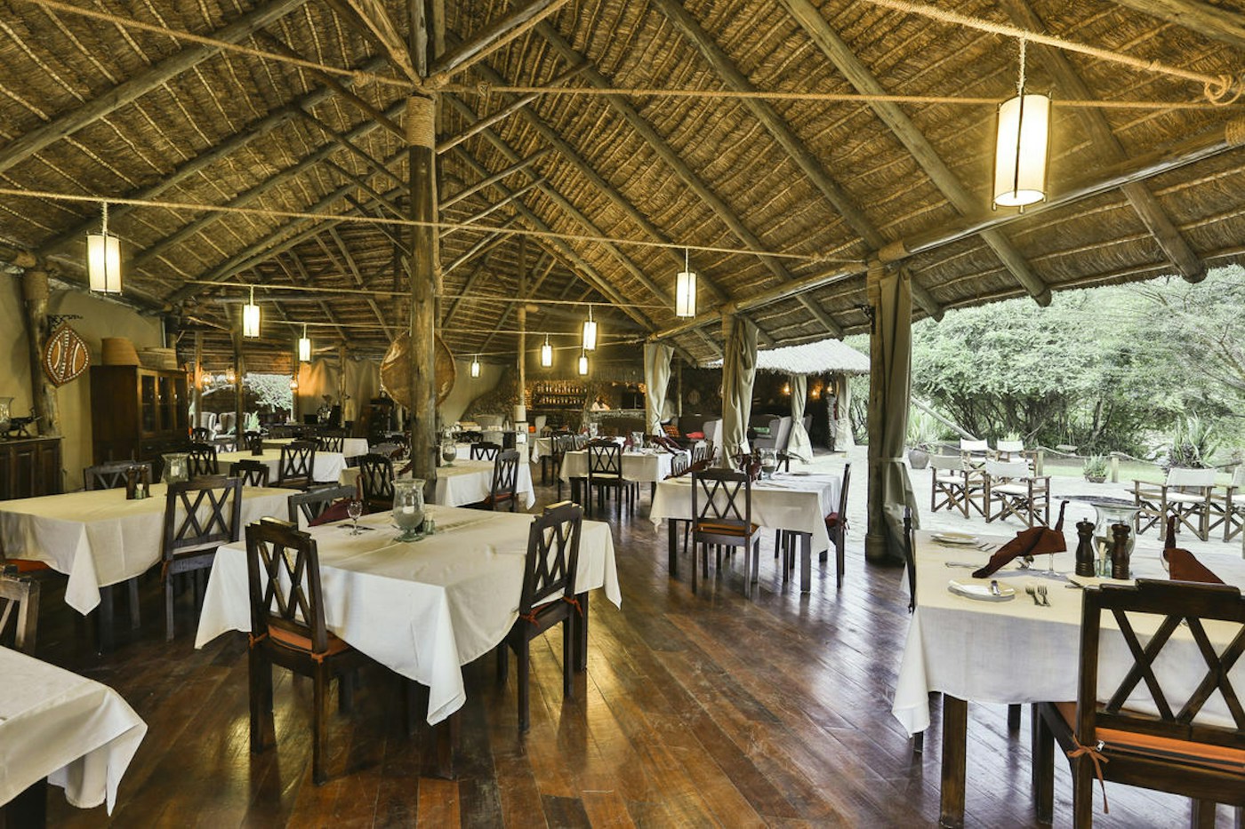 Open-sided restaurant and dining tables at Karen Blixen Camp