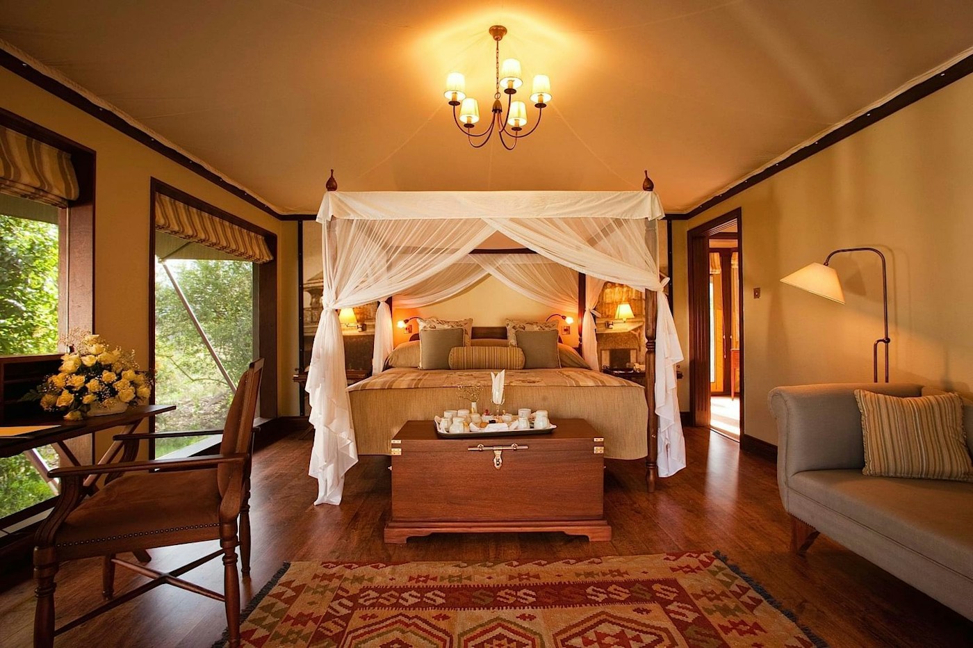 Four-poster bed inside a guest tent at Lake Elmenteita Serena Camp