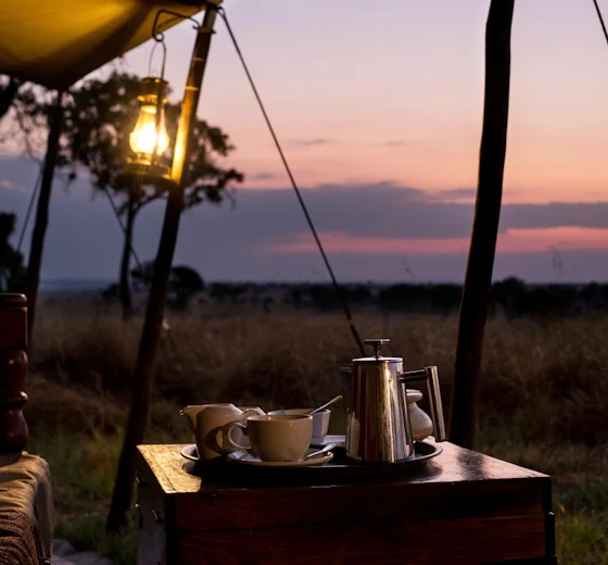 Coffee at dusk on a camp side table overlooking the plains, Tanzania