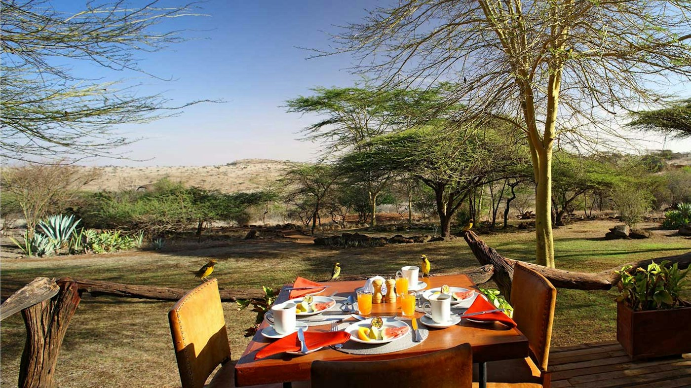 Breakfast table looking onto the camp gardens at Lewa Safari Camp