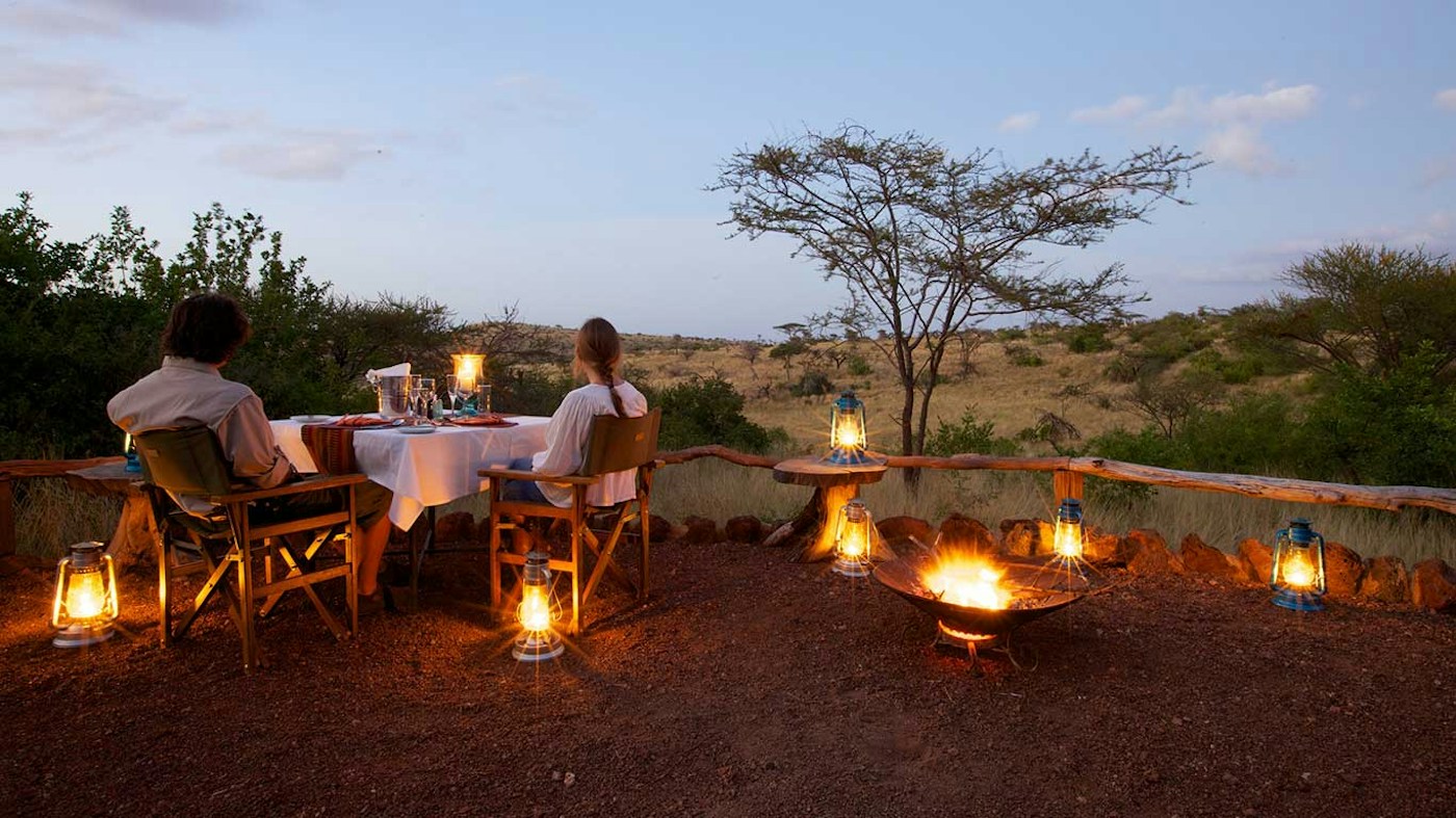 Bush dinner beside a campfire at Lewa Safari Camp