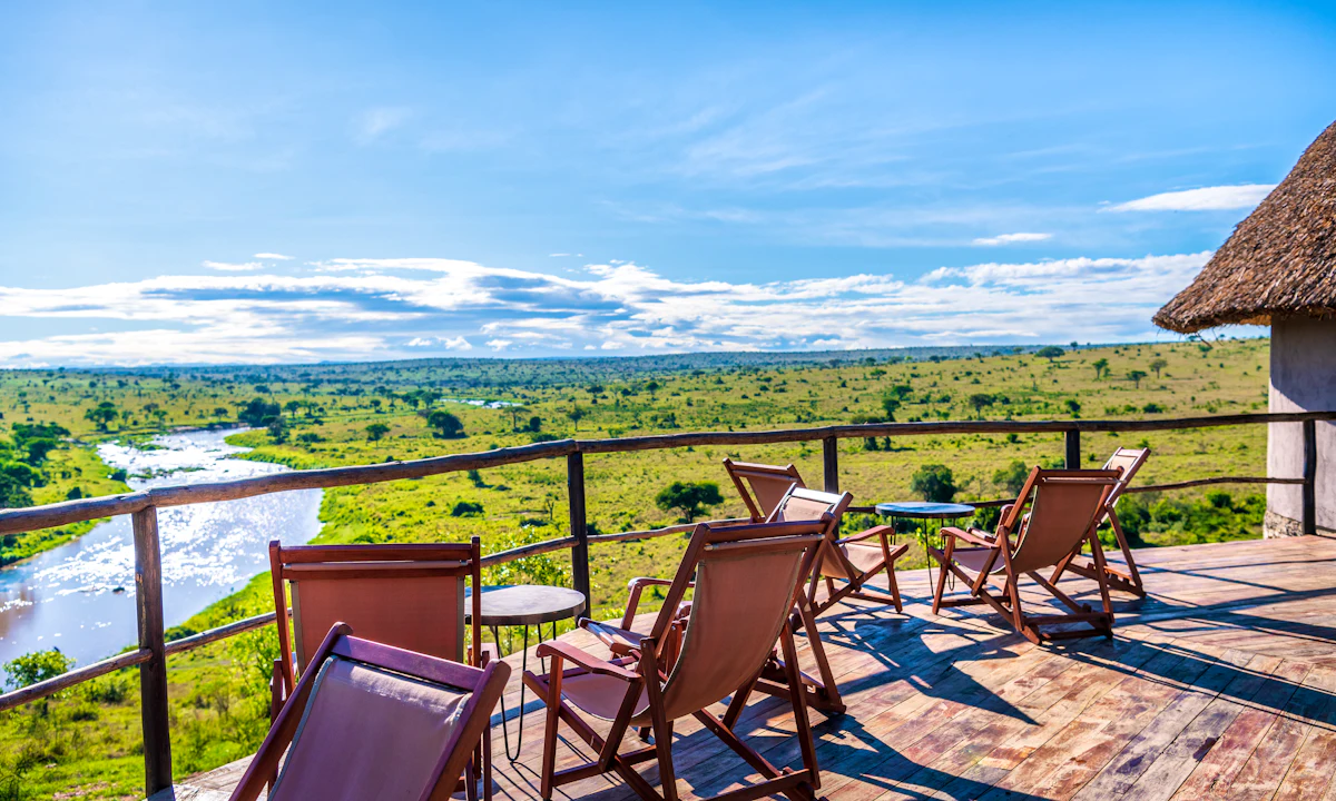 A safari vehicle travelling through the northern Tanzania landscape