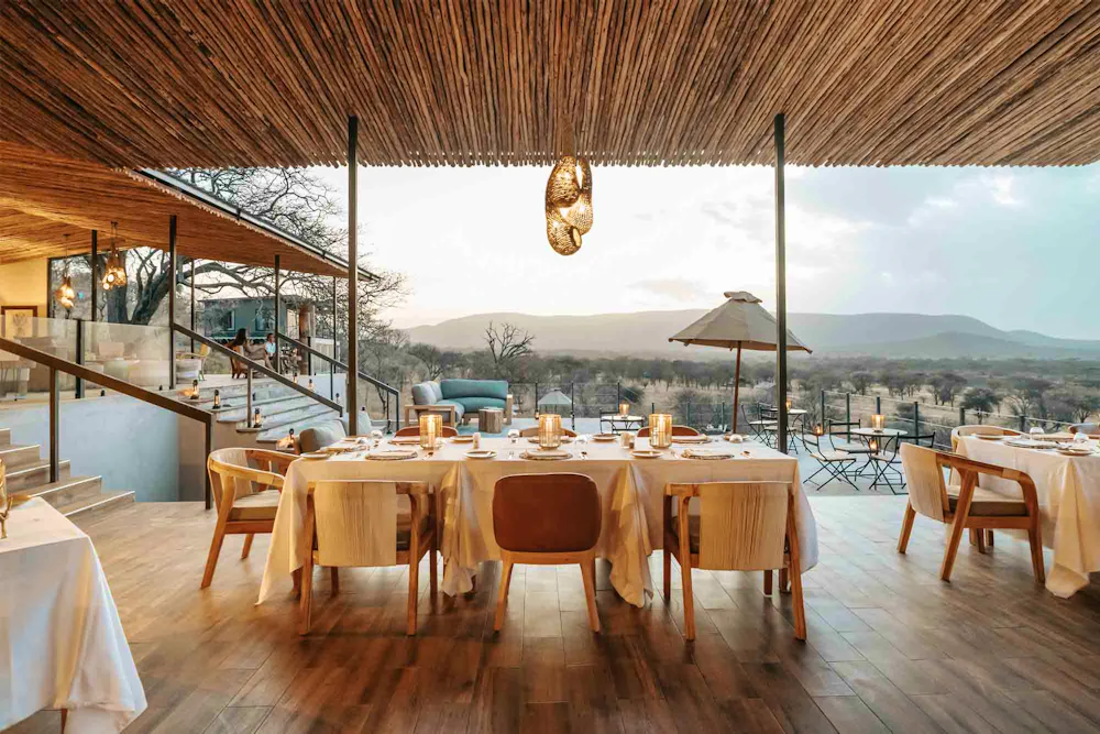 An open-sided dining deck with plains views at Nimali Central Serengeti, Tanzania