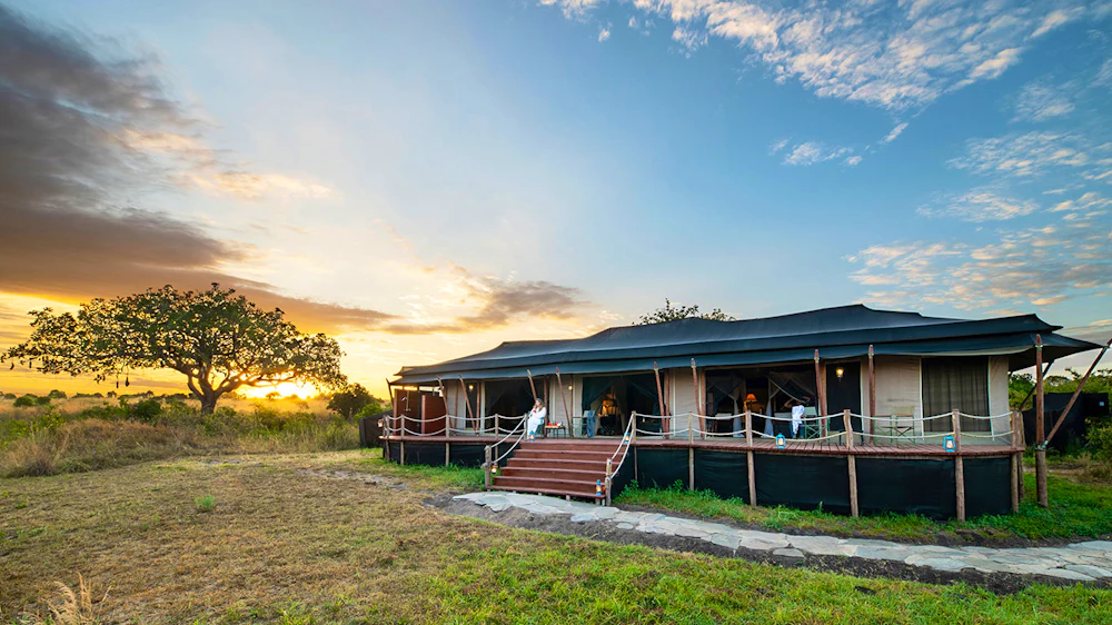 A tented safari camp beside the river in the Maasai Mara, Kenya