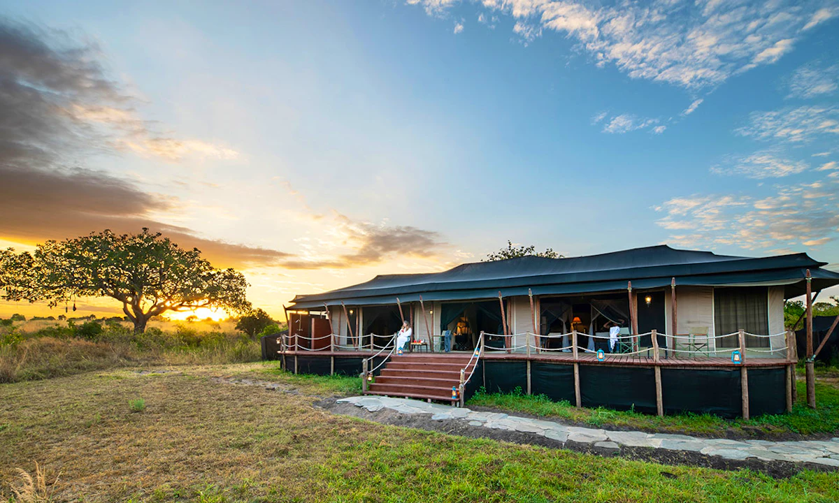 A romantic safari lodge overlooking the Masai Mara at sunset
