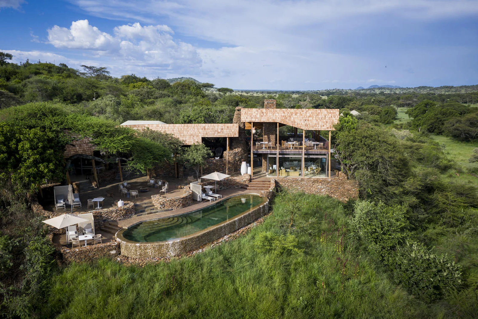 Aerial view of the lodge and pool at Singita Faru Faru Lodge