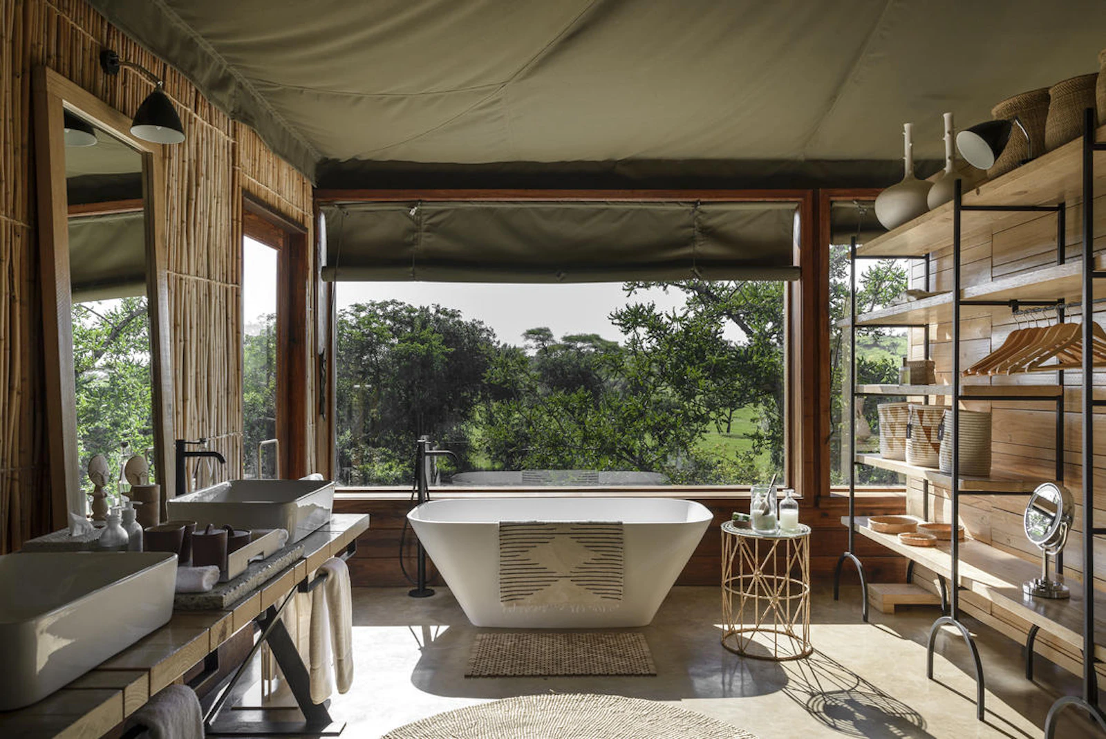 Guest bathroom and freestanding bath at Singita Faru Faru Lodge