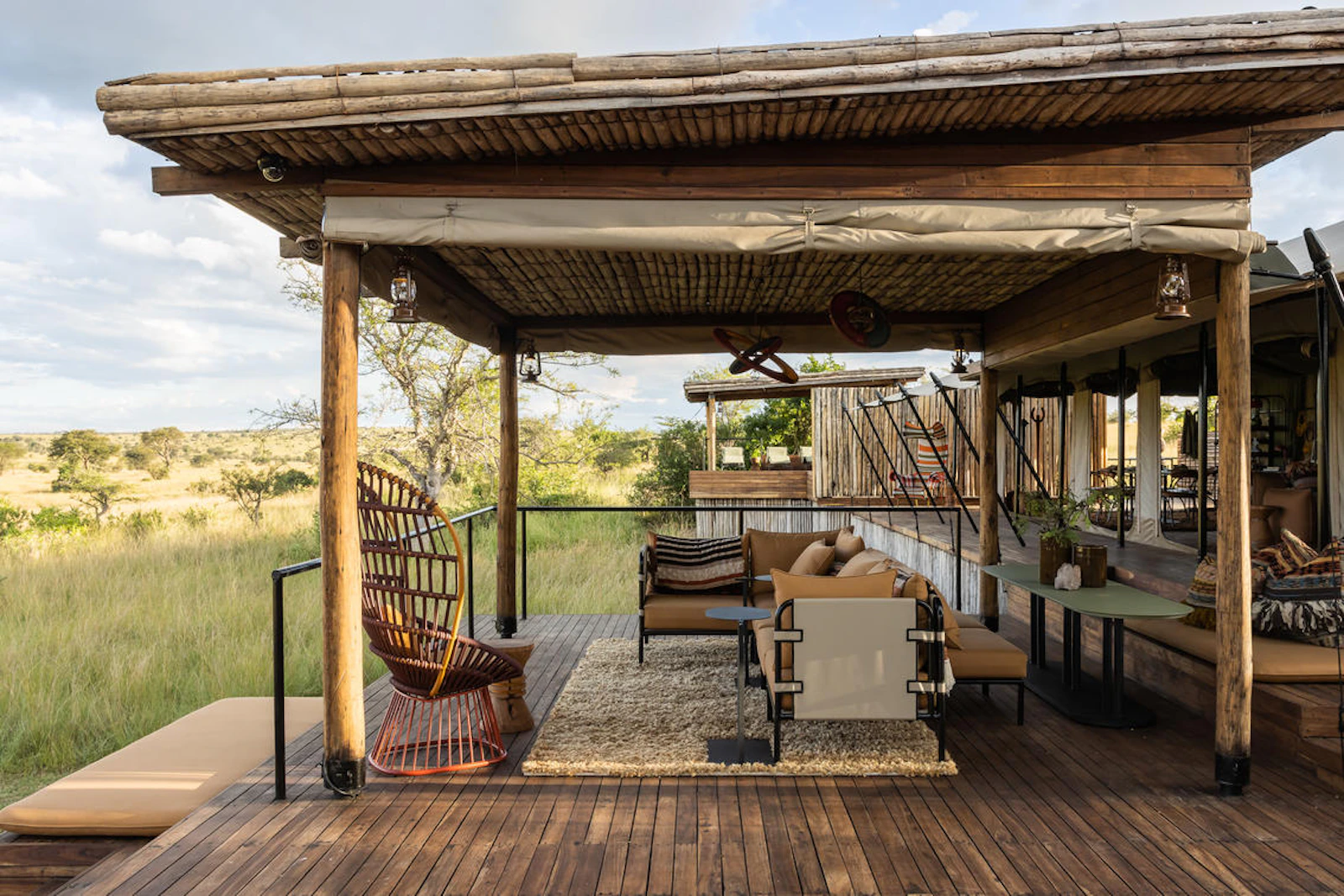 Open-air lounge deck at Singita Mara River Tented Camp