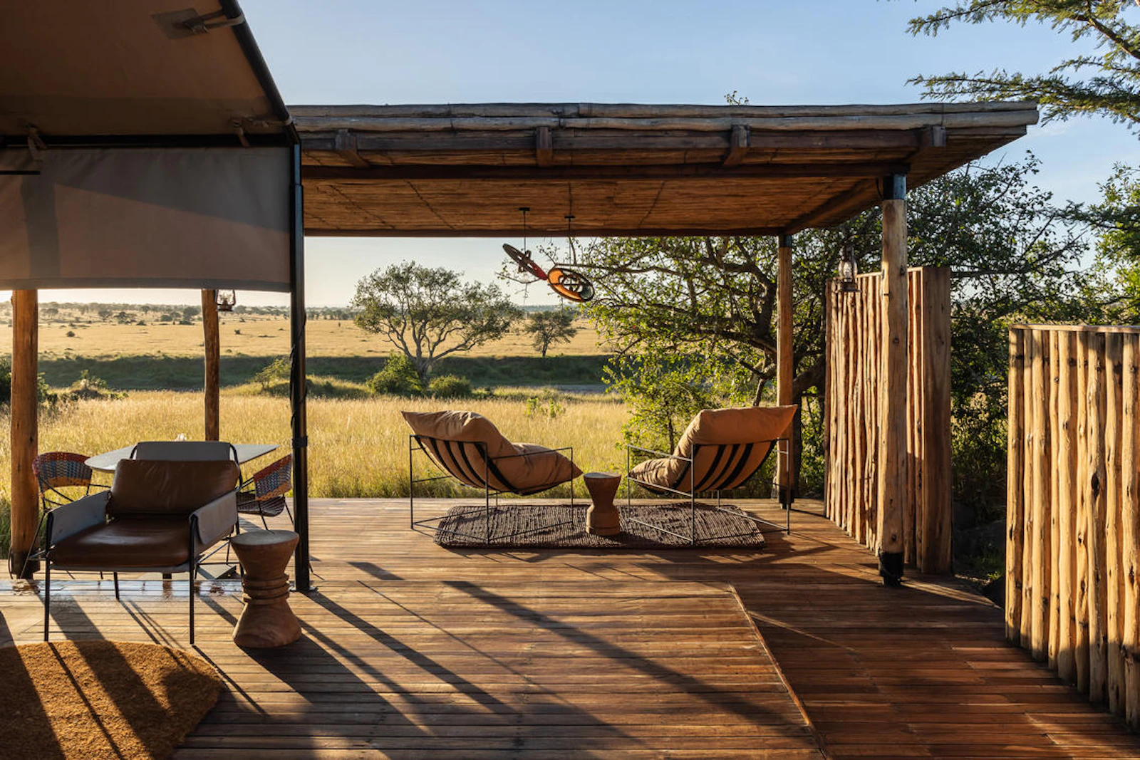 Guest deck and loungers at Singita Mara River Tented Camp